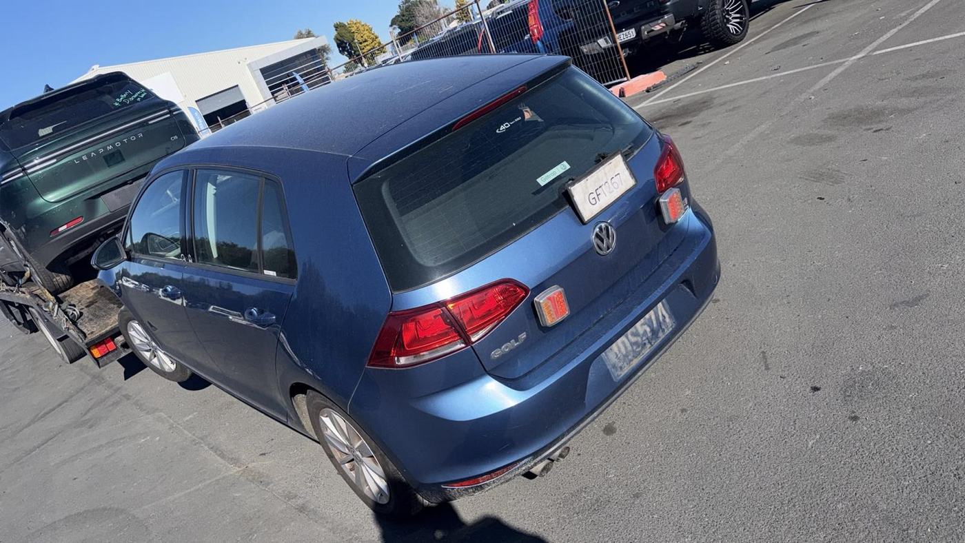 Blue VW Golf loaded for wrecking and parts recovery at the Ashburton yard
